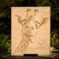 Illuminated giraffe lithophane panel on a display stand